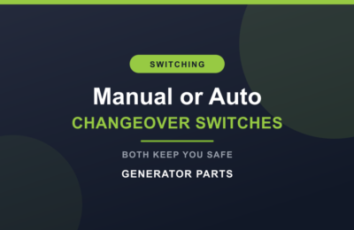 Manual changeover switch beside an automatic transfer switch for a generator